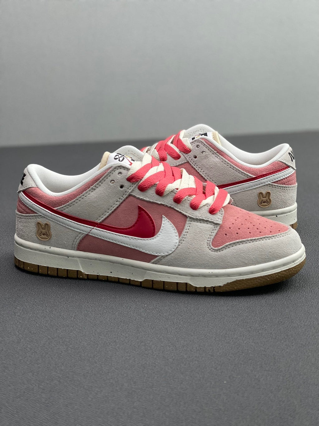 Nike Dunk Low SE Rabbit Year Sneakers in Pink White DO9457-117 - product image from the listing.