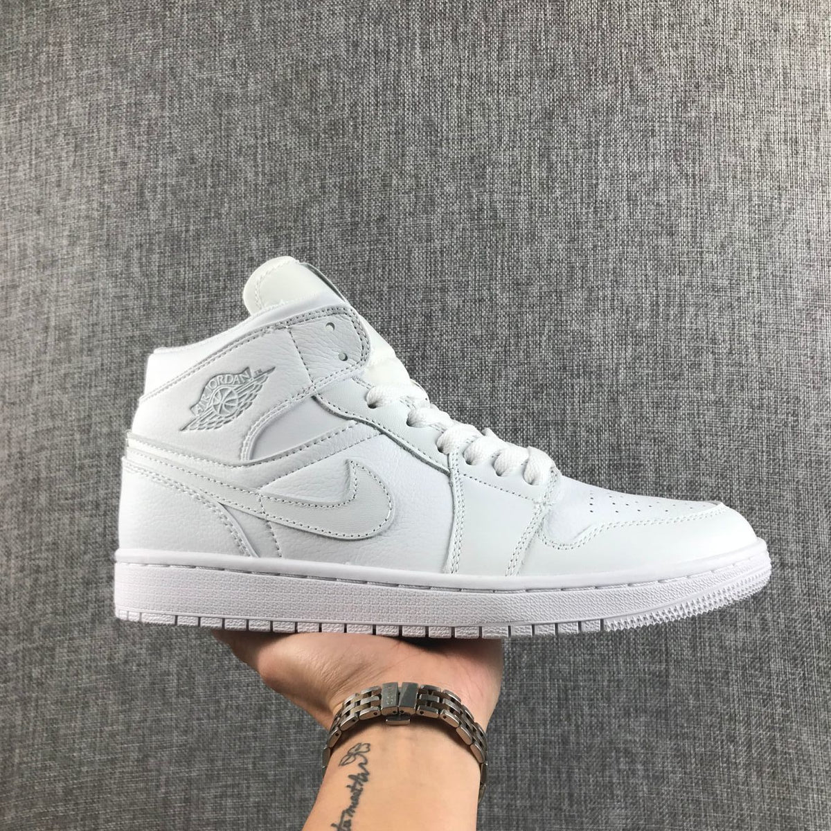 Air Jordan 1 Mid Sneakers in White - product image from the listing.
