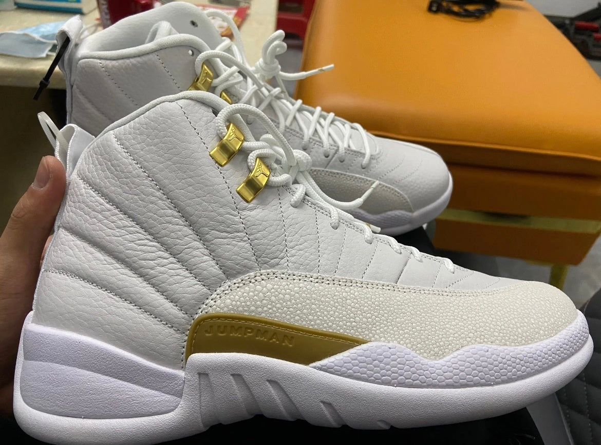 Air Jordan 12 OVO Sneakers in White 873864-102 - product image from the listing.
