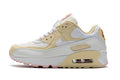 Women's Nike Air Max 90 Sneakers in Cream and Pink - product image from the listing.