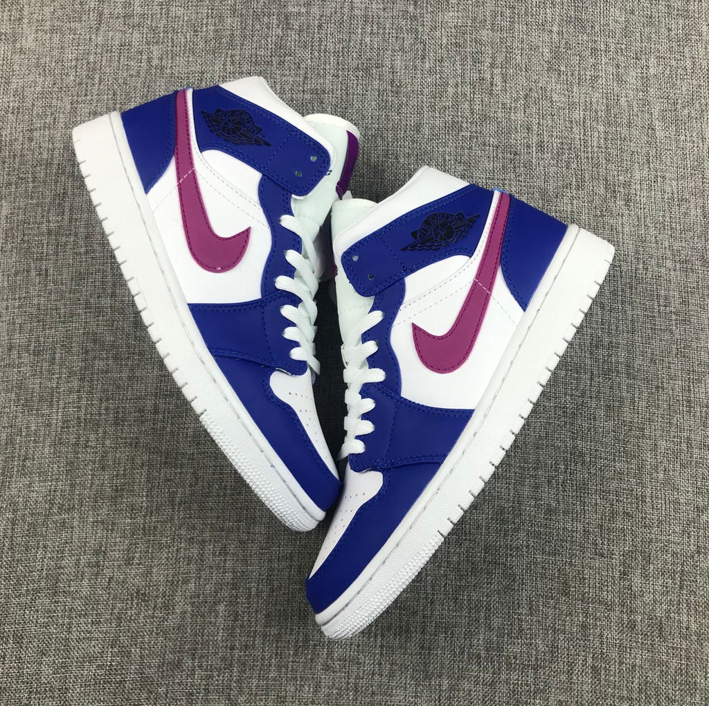 Air Jordan 1 Mid Sneakers in Blue Pink 554724-451 - product image from the listing.