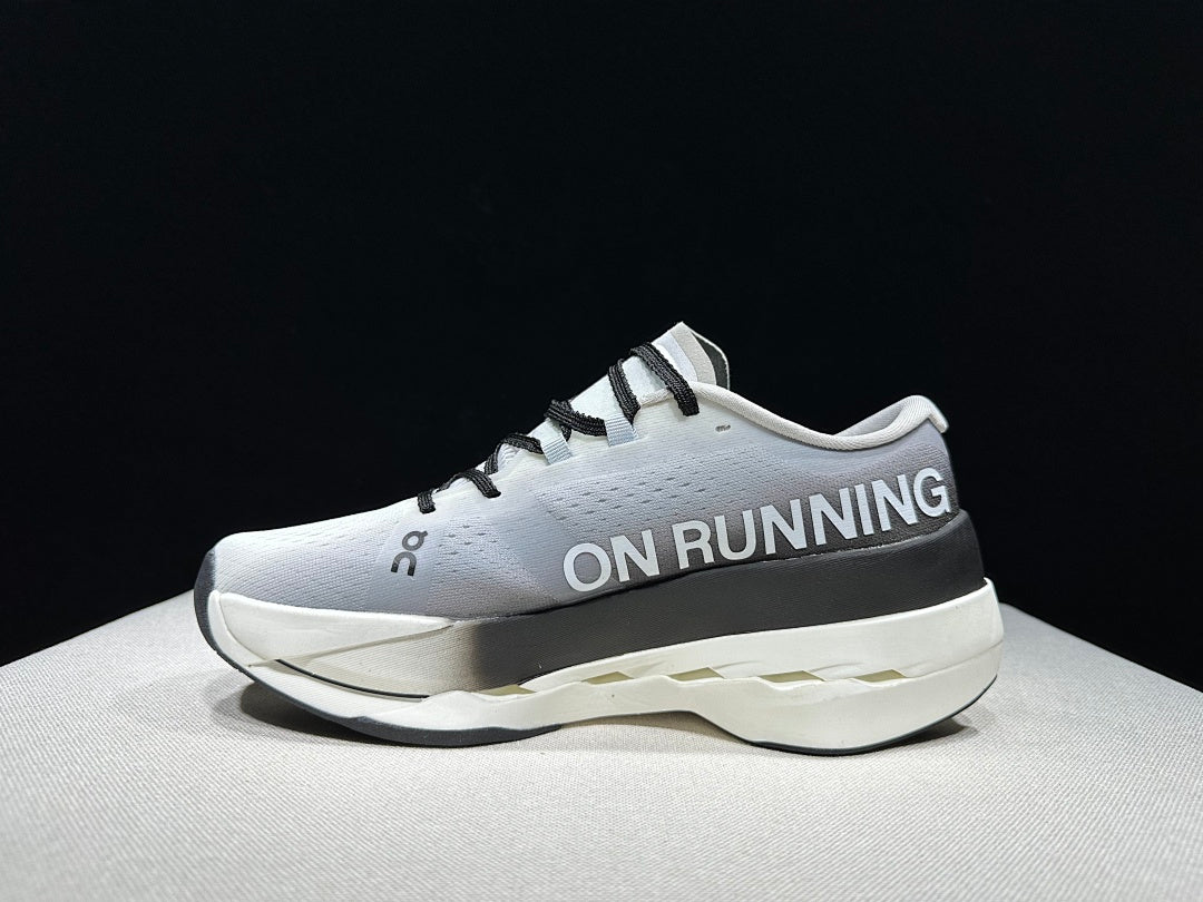 On Cloudboom Max Running Shoes, in White and Black - product image from the listing.