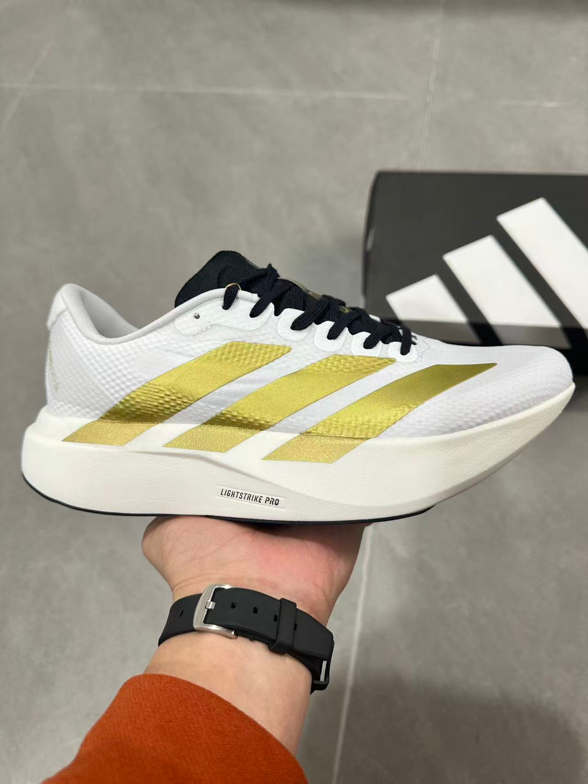 Adidas Lightstrike Pro Running Shoes in White Gold JQ4441 - product image from the listing.