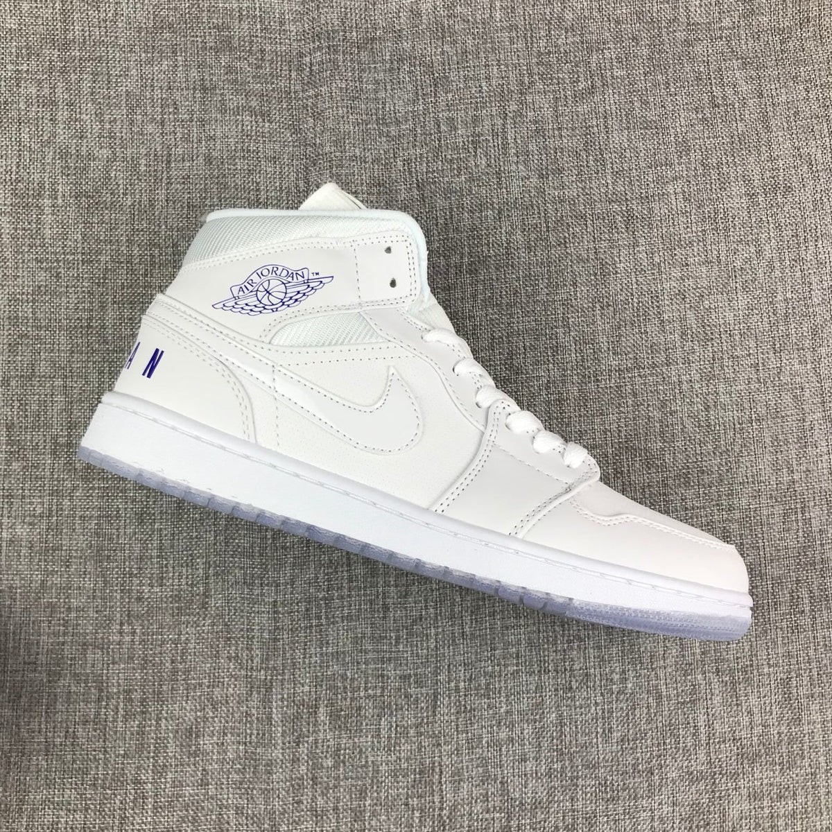White Sneakers with Translucent Outsole - Air Jordan 1 Mid - product image from the listing.