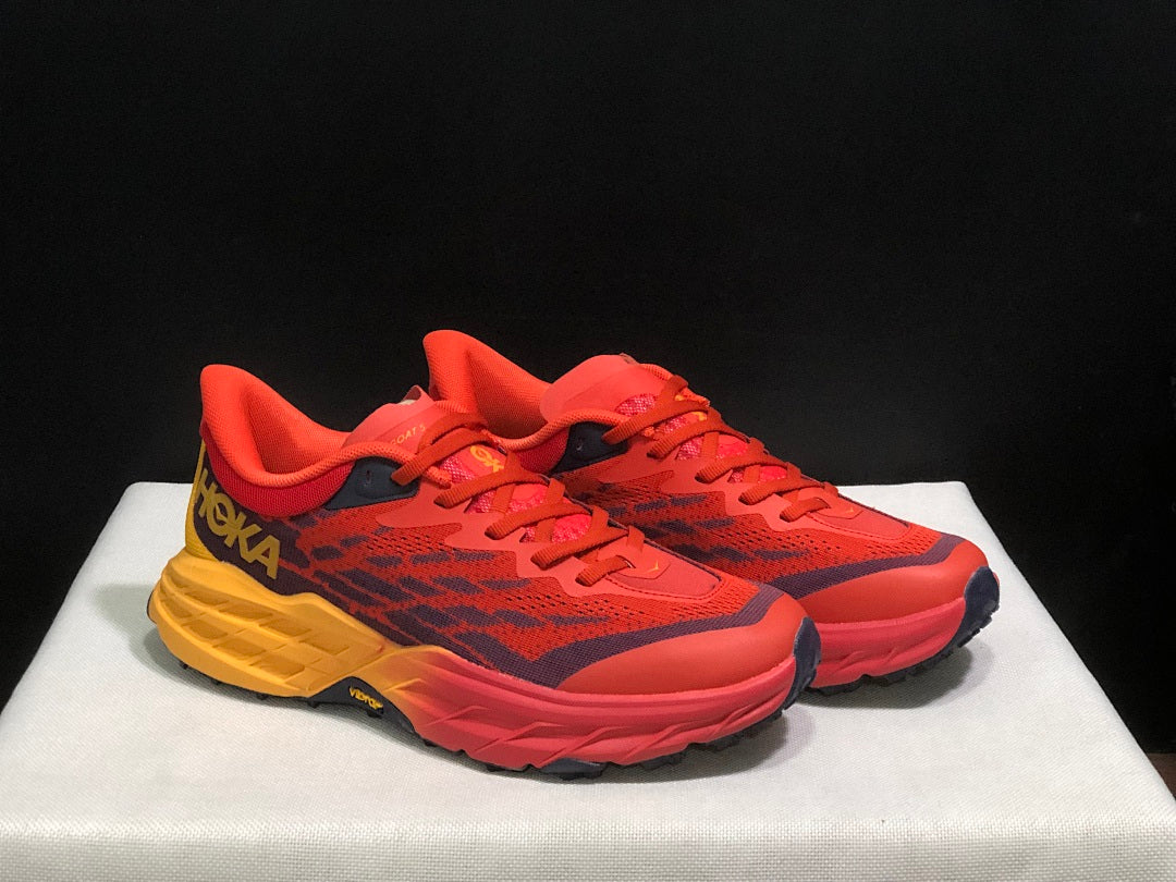 HOKA Speedgoat 5 Trail Running Shoes in Red and Yellow - product image from the listing.