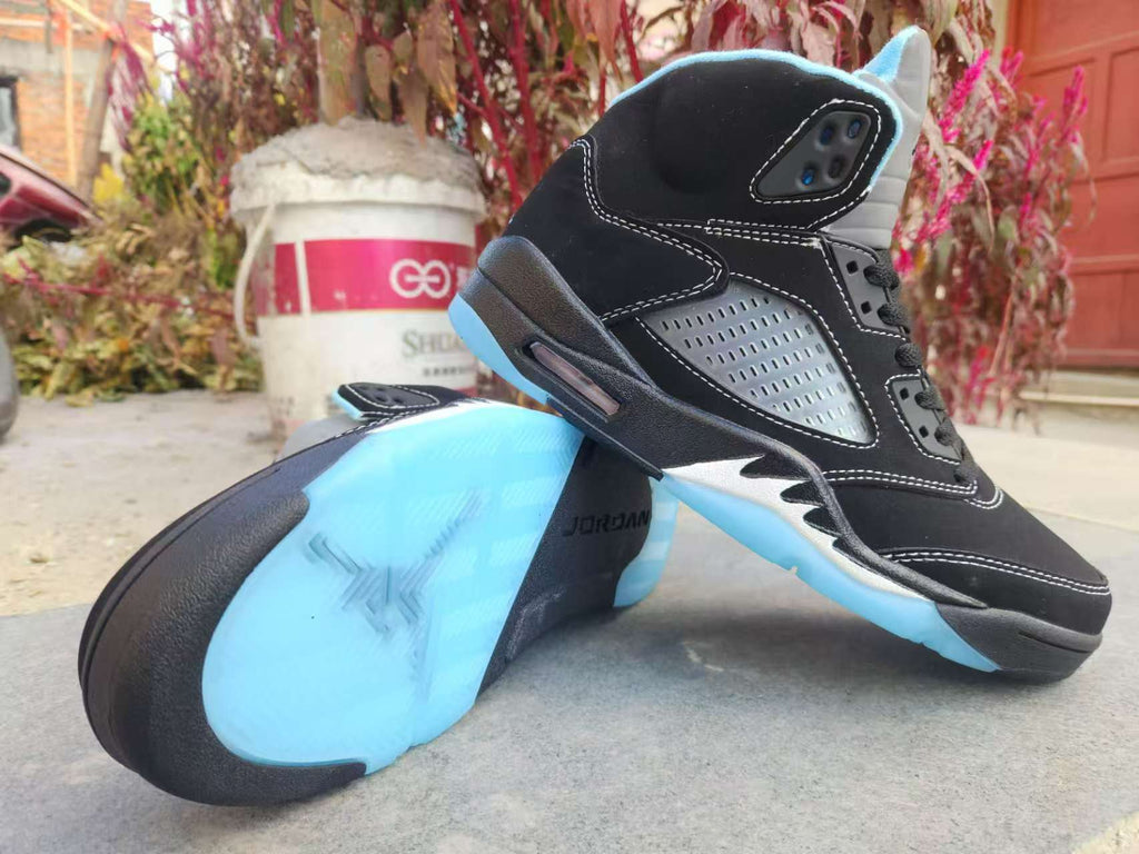 Air Jordan 5 Low in Black/University Blue - product image from the listing.