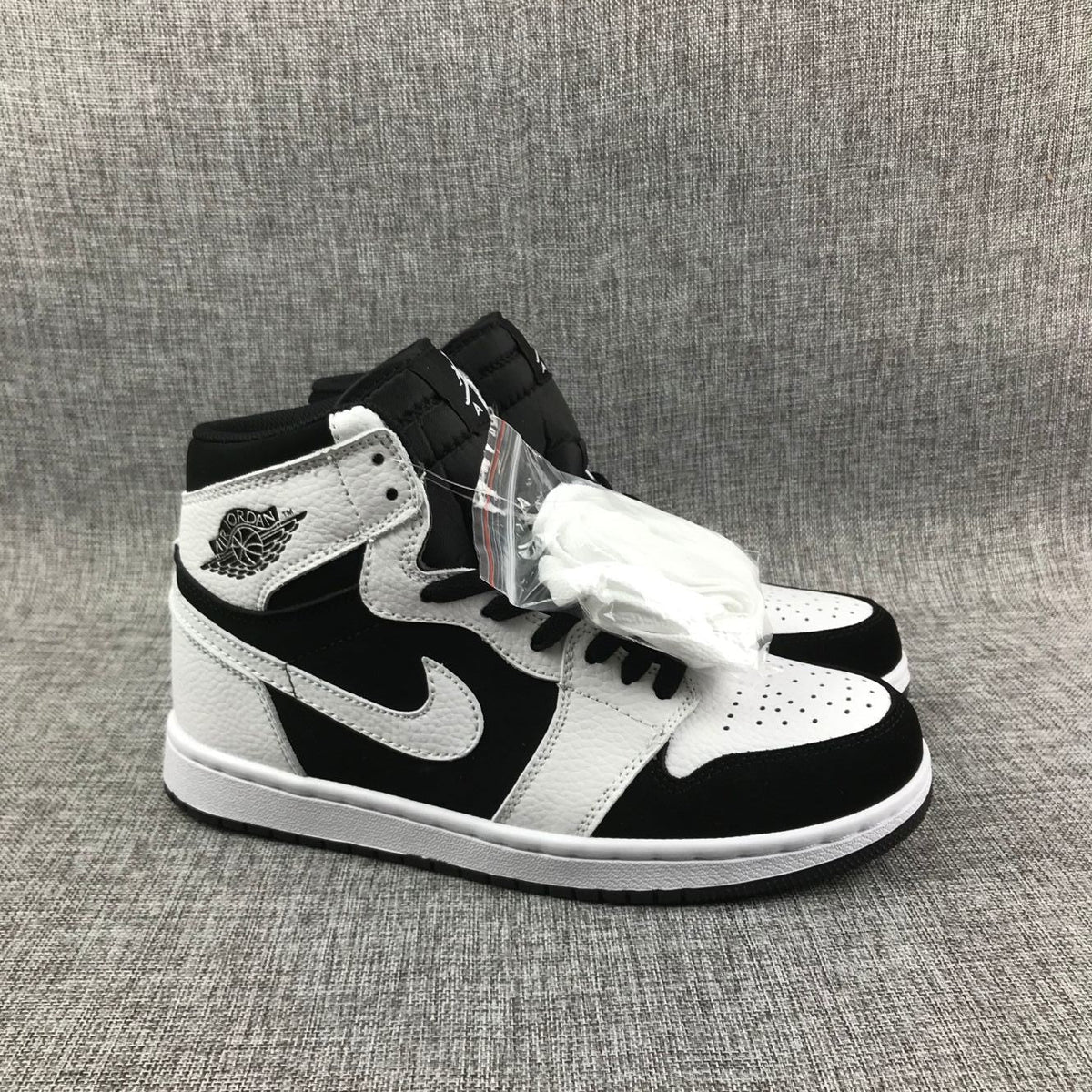 Air Jordan 1 High Sneakers in Black and White 554724-113 - product image from the listing.