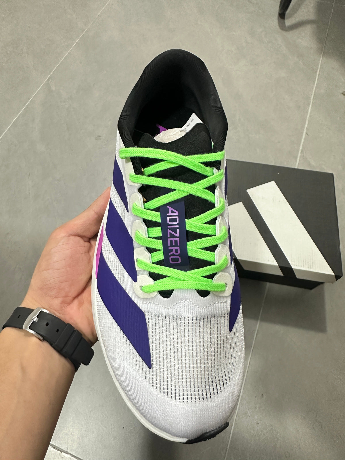 Adizero Lightstrike Pro Running Shoes in White Purple Green - product image from the listing.