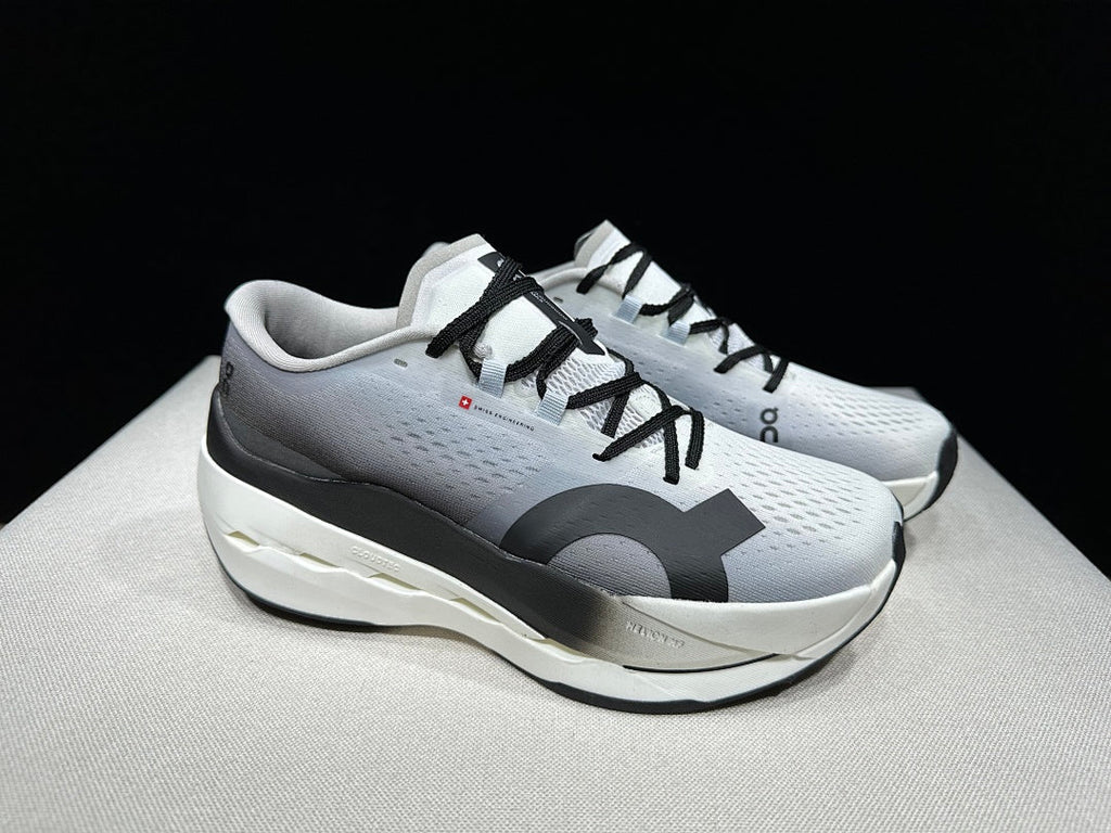 On Cloudboom Max Running Shoes, in White and Black - product image from the listing.
