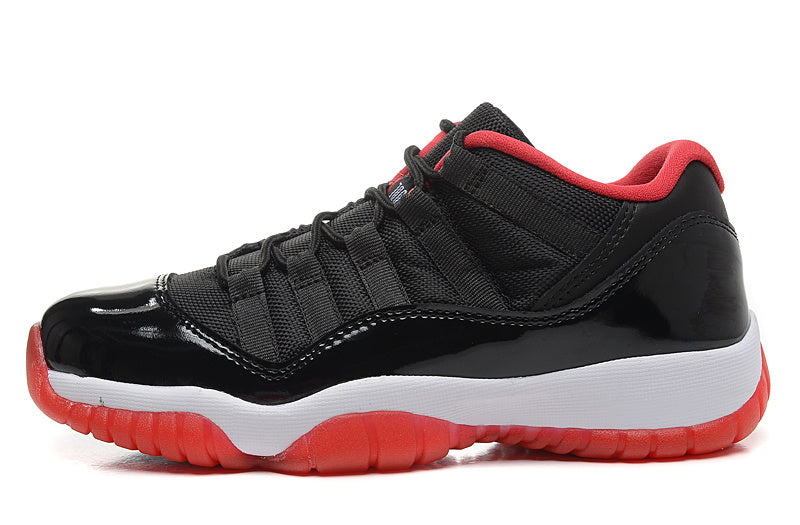 Air Jordan 11 Retro Low Black Red Sneakers - product image from the listing.