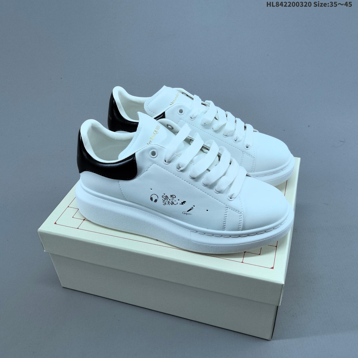Alexander McQueen Oversized Low-Top Sneakers, in White and Black - product image from the listing.
