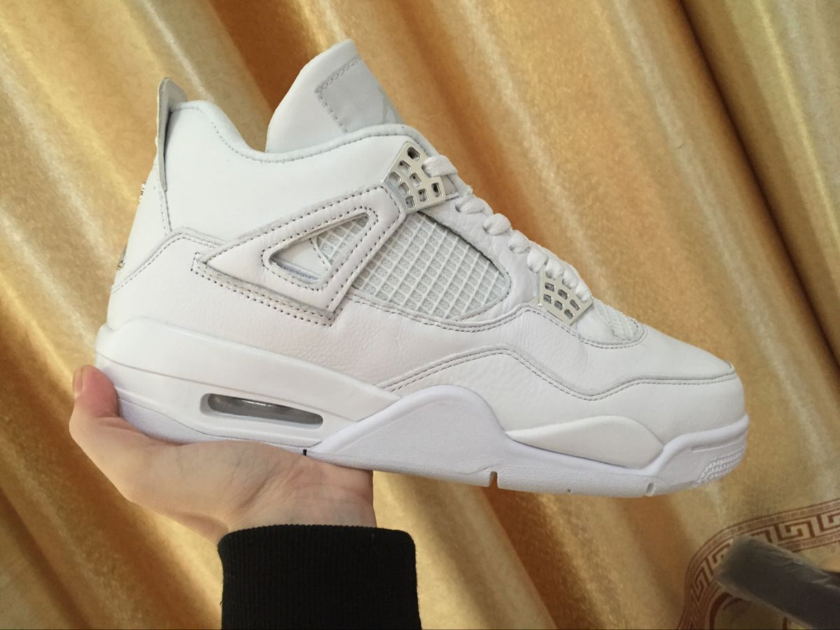 Air Jordan 4 Retro White High-Top Sneakers - product image from the listing.