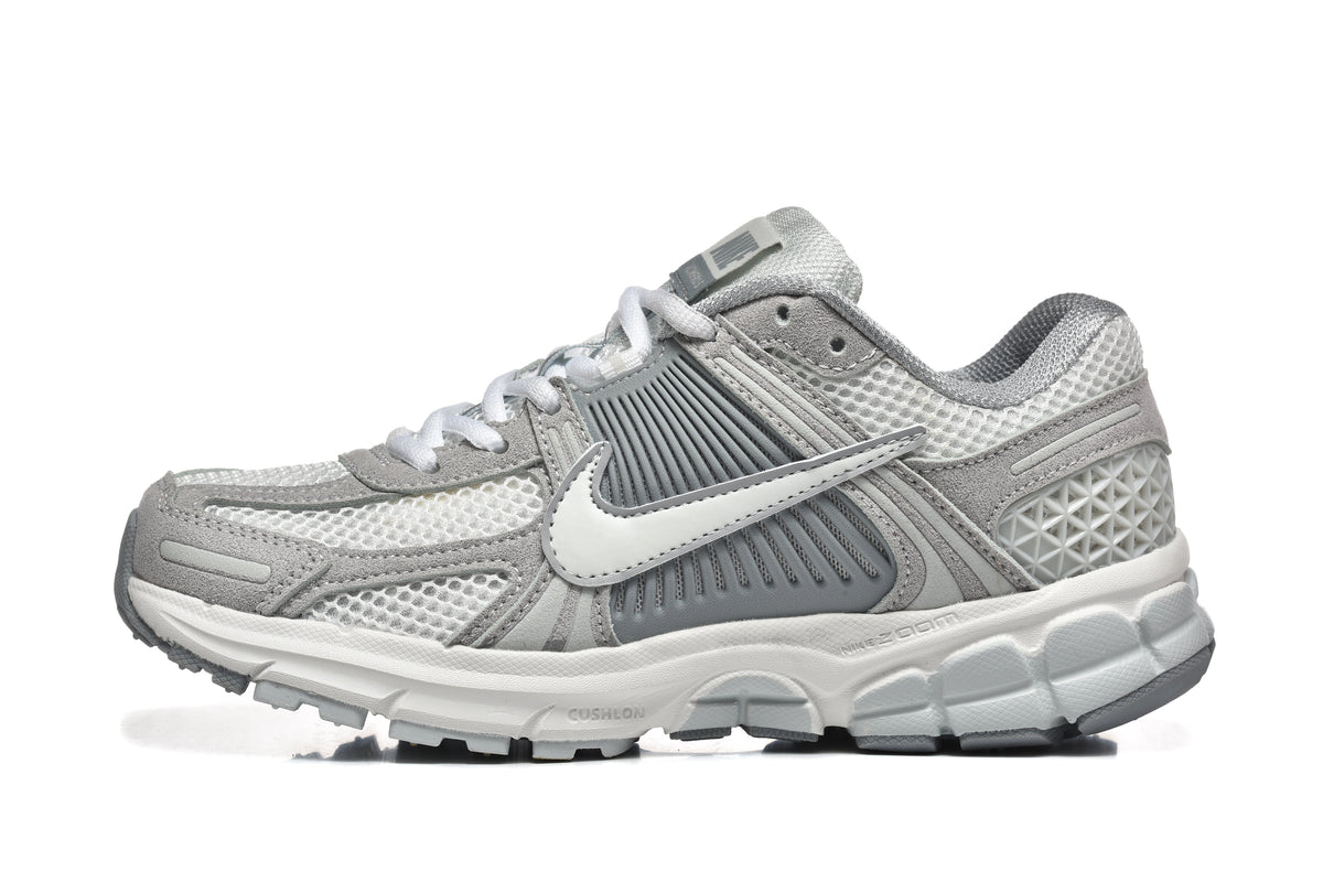 Grey and White Nike Vomero 5 Sneakers - product image from the listing.