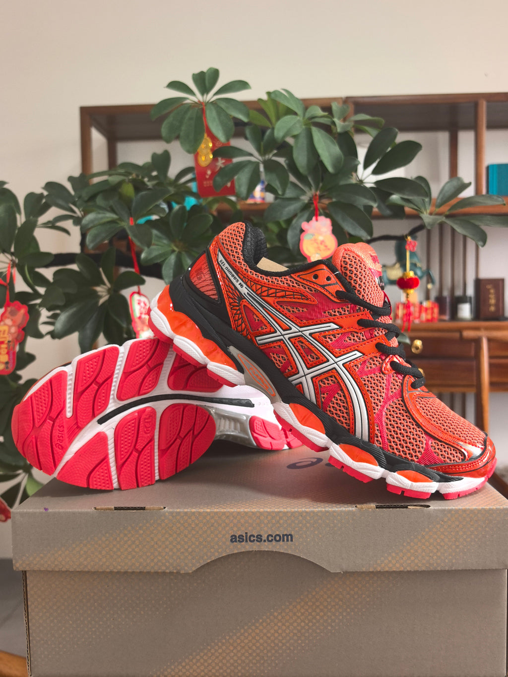 ASICS GEL-KAYANO 14 Sneakers in Orange and Pink - product image from the listing.