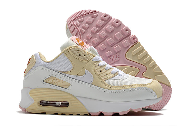 Women's Nike Air Max 90 Sneakers in Cream and Pink - product image from the listing.