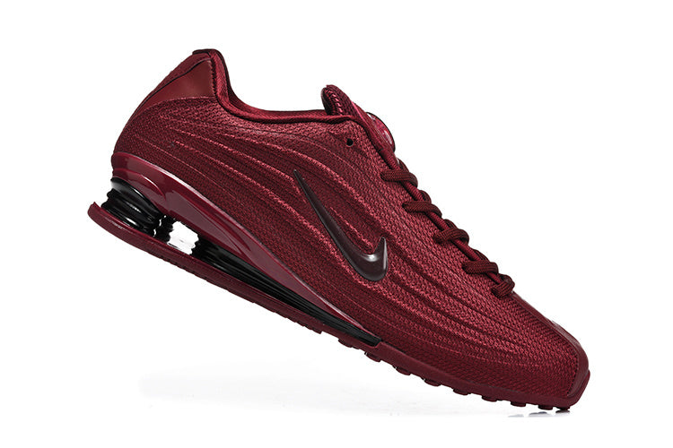 Nike Shox TL Low-Top Sneakers in Red - product image from the listing.