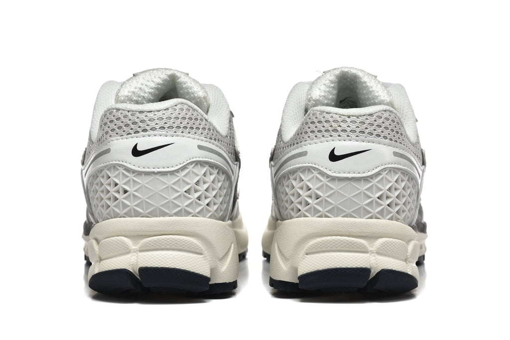 Nike Vomero 5 Sneakers in Silver and White - product image from the listing.