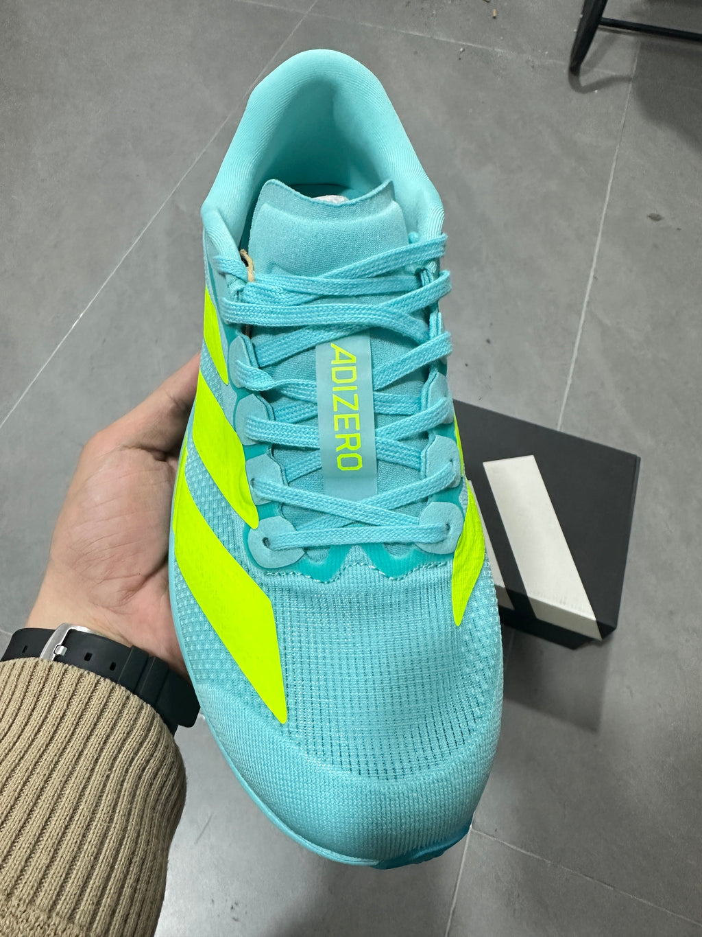 Adidas Lightstrike Pro Running Shoes, in Turquoise and Volt - product image from the listing.