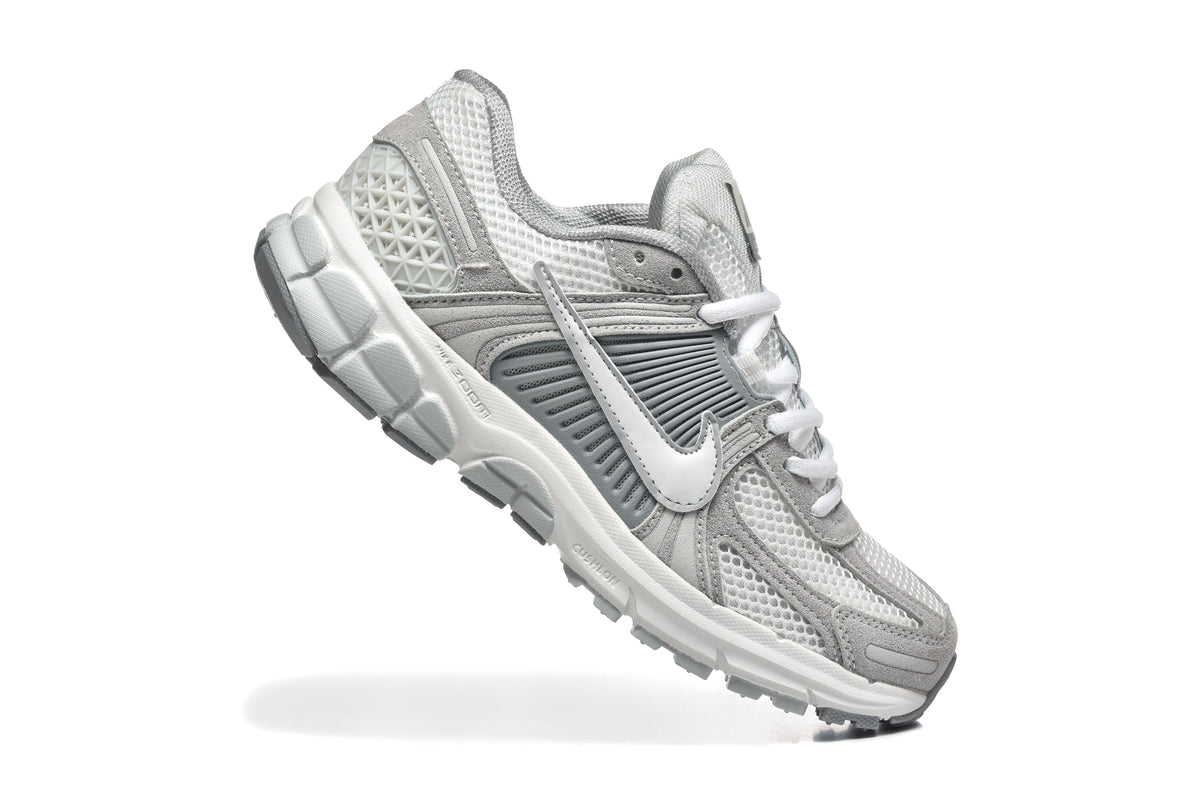 Grey and White Nike Vomero 5 Sneakers - product image from the listing.