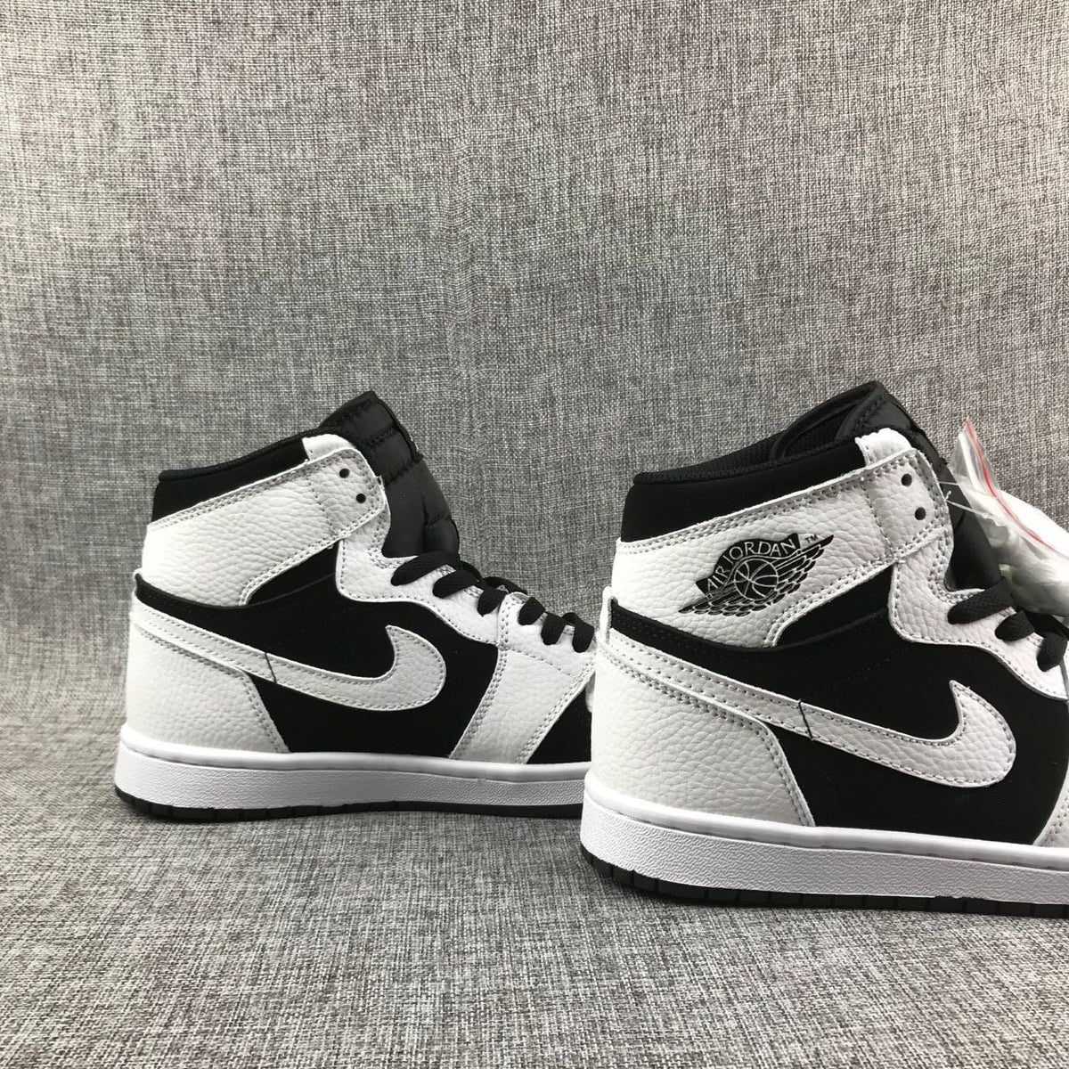 Air Jordan 1 High Sneakers in Black and White 554724-113 - product image from the listing.