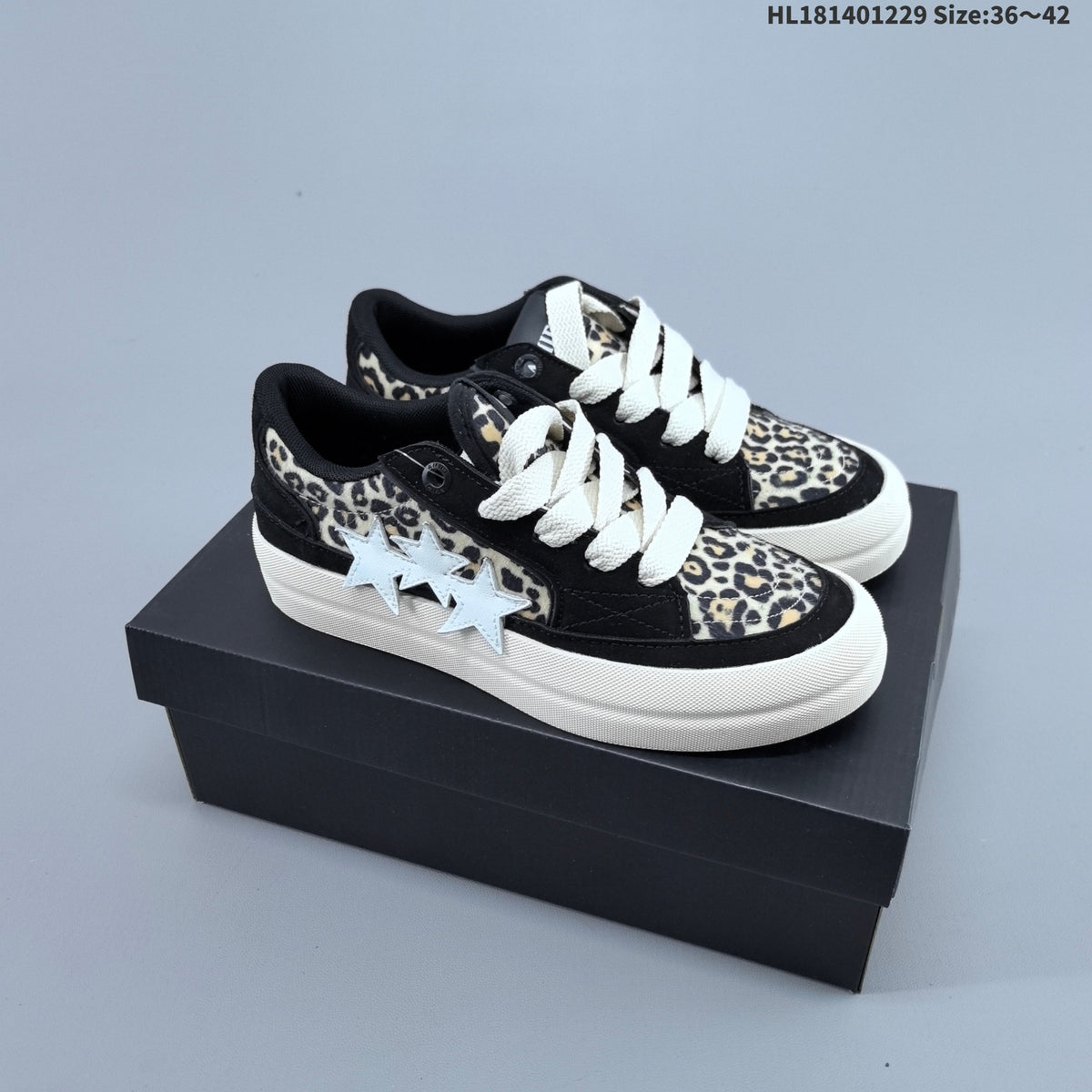 AMIRI Star Low-Cut Sneakers with Leopard Print Details - product image from the listing.
