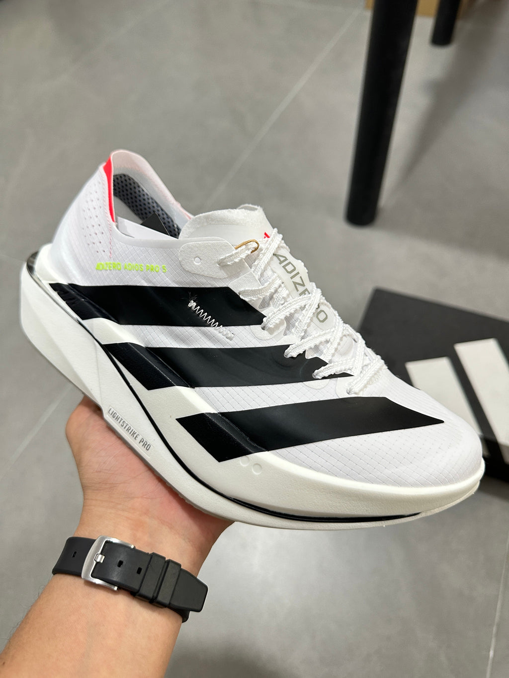 adidas Lightstrike Pro Running Shoes in White Black KI8290 - product image from the listing.