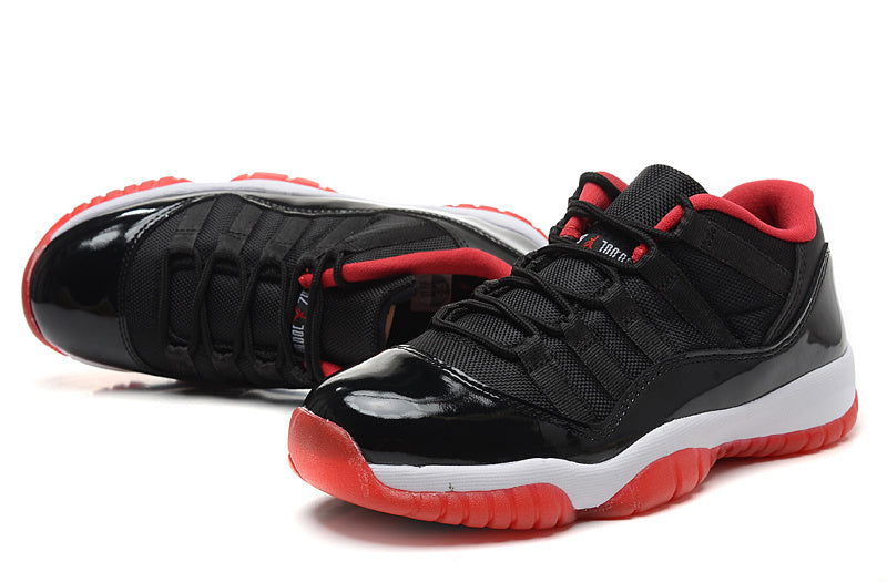 Air Jordan 11 Retro Low Black Red Sneakers - product image from the listing.