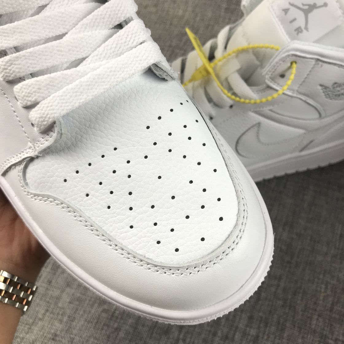 Air Jordan 1 Mid Sneakers in White - product image from the listing.