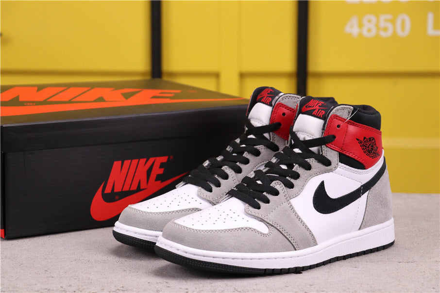 Air Jordan 1 High Sneakers in Light Smoke Grey 555088-126 - product image from the listing.