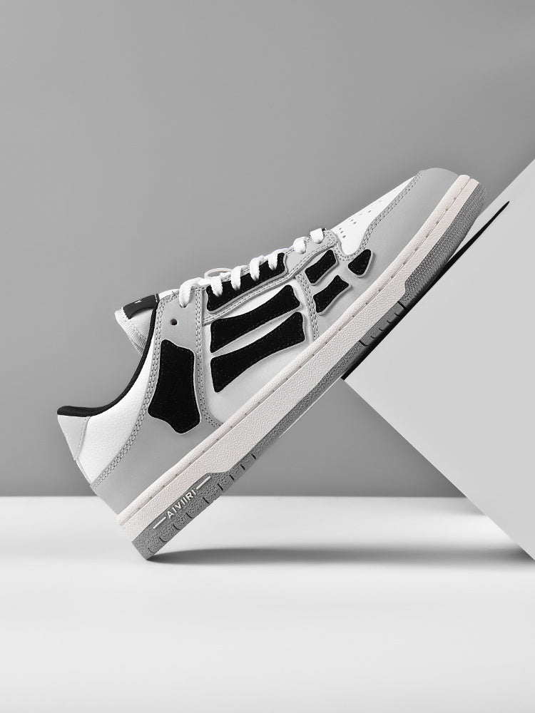 AMIRI Gray and White Low-Cut Sneakers with Black Accents - product image from the listing.