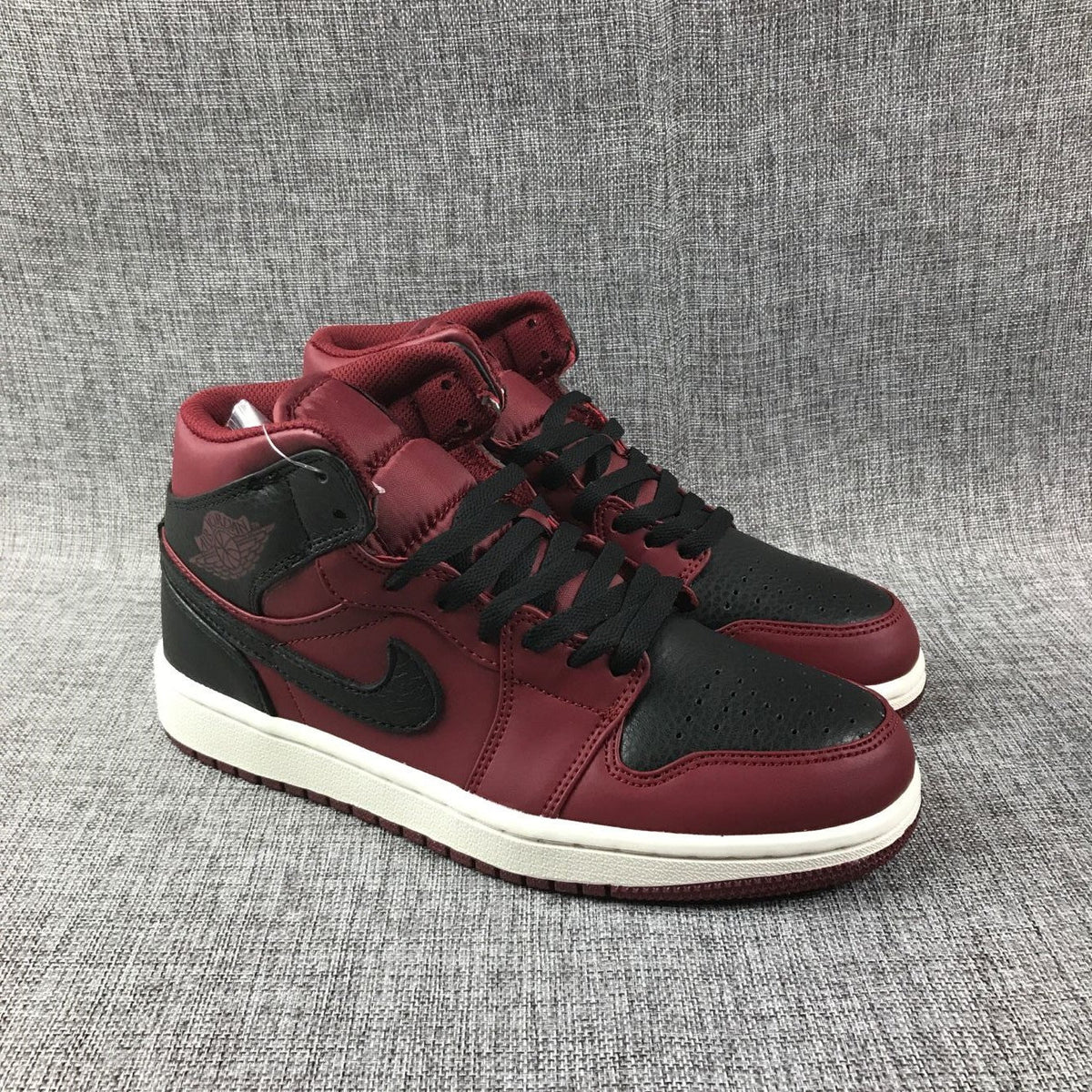 Air Jordan 1 Mid High-Top Sneakers in Burgundy and Black - product image from the listing.