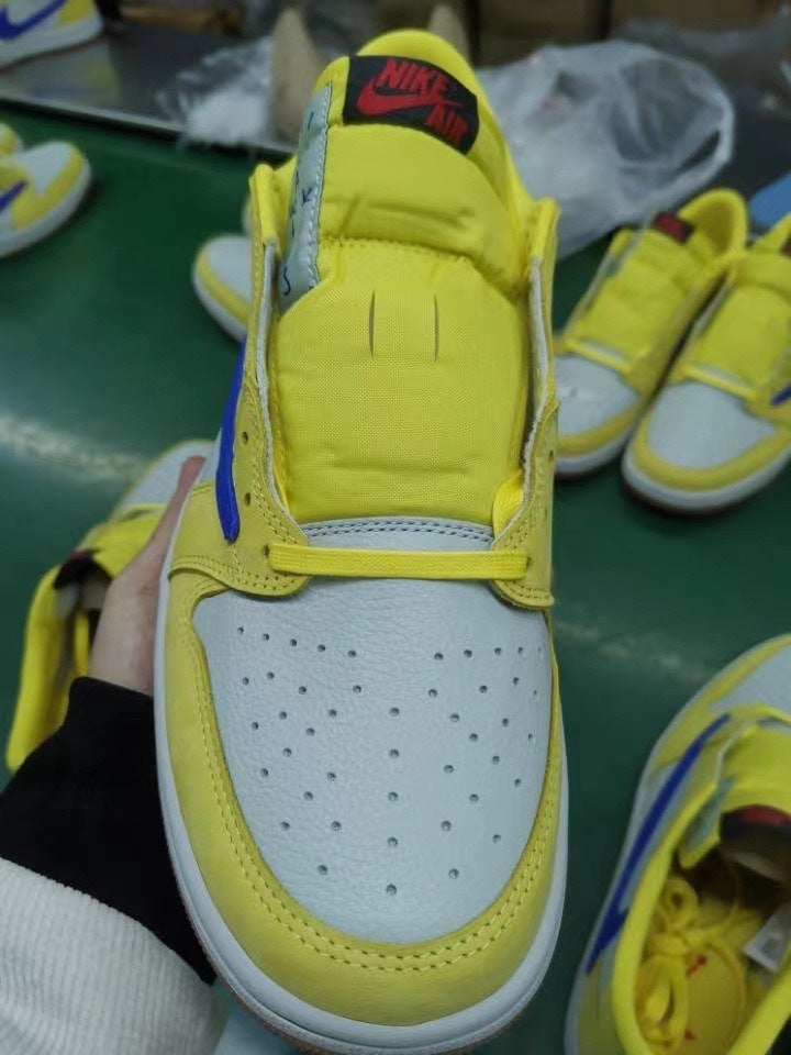 Jordan 1 Low Sneakers in Canary Yellow and Blue DZ4137-700 - product image from the listing.