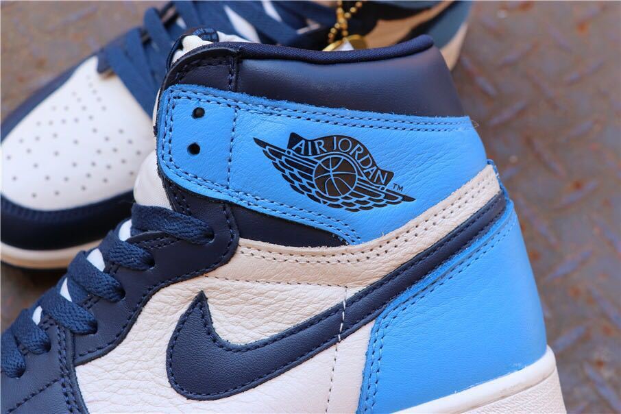 Air Jordan 1 Retro High OG Sneakers in Blue and White - product image from the listing.