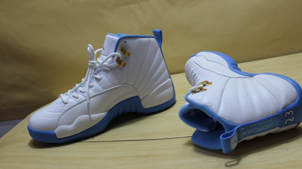 Air Jordan 12 High-Top Sneakers in University Blue 510815-127 - product image from the listing.