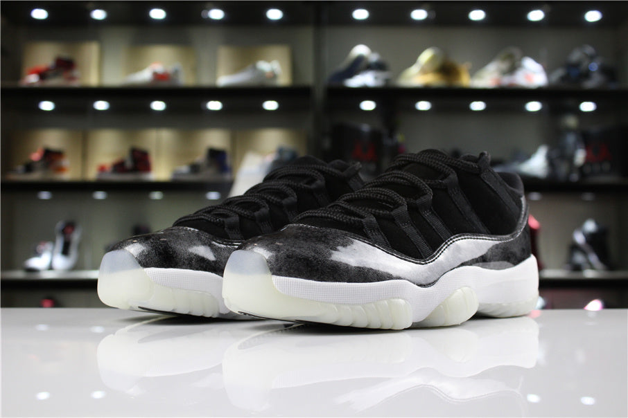 Jordan 11 Retro Low Barons Sneakers in Black White - product image from the listing.