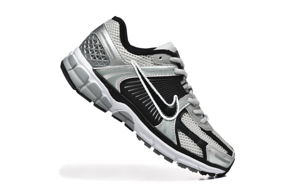 Nike Silver and Black Mesh Trainers - product image from the listing.