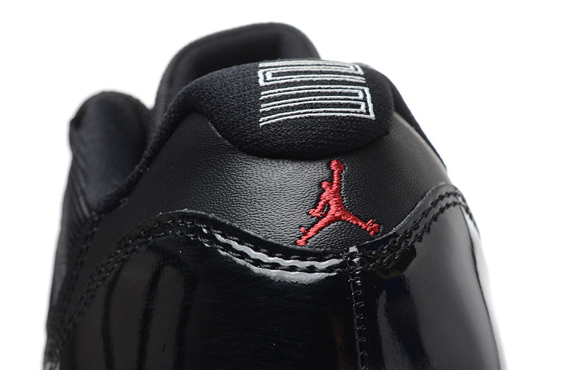 Air Jordan 11 Retro Low Black and Red Sneakers - product image from the listing.