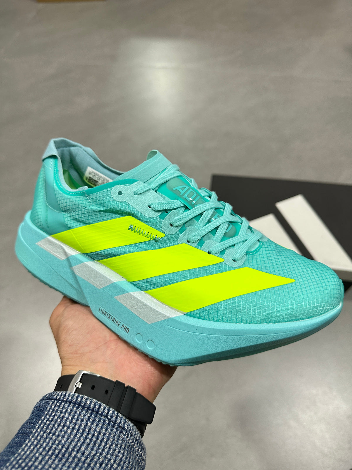 Aqua and Volt Nike Lightstrike Pro Running Shoes - product image from the listing.