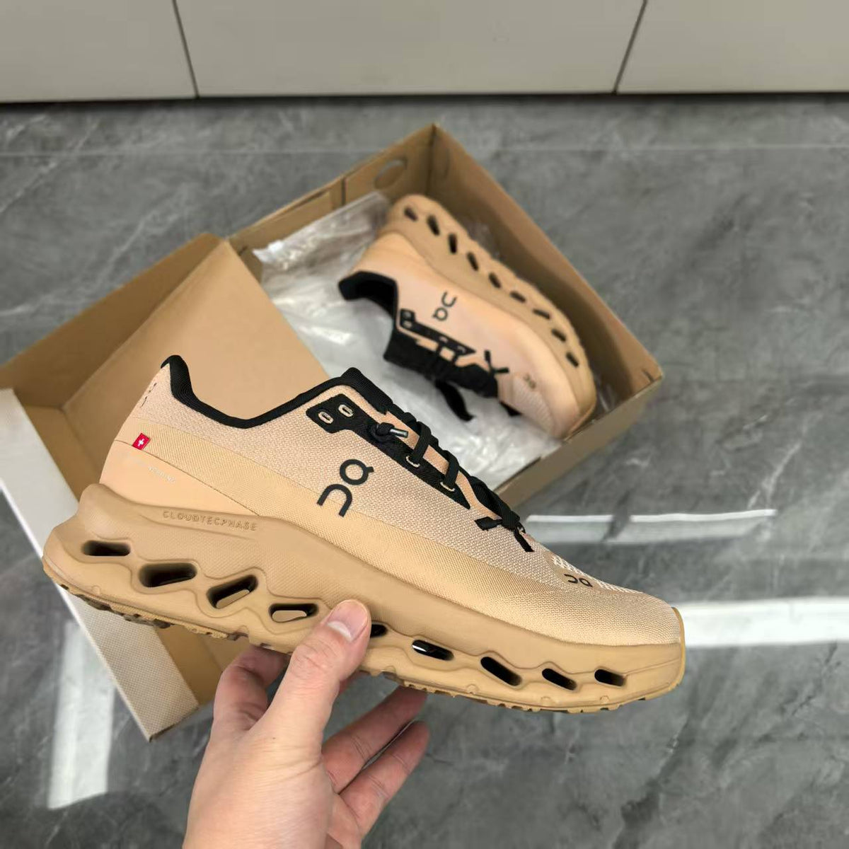 Beige and Black On Running Shoes - product image from the listing.