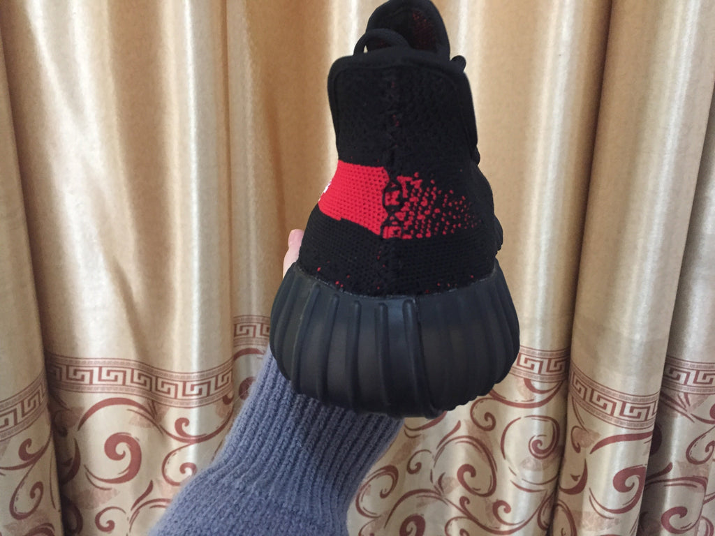 Yeezy 350 V2 Sneakers in Black and Red Knit - product image from the listing.