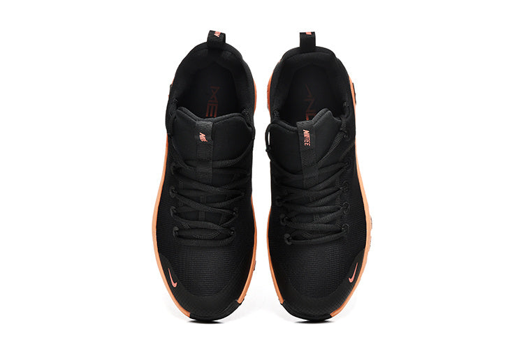 Nike Free TR Fitness Sneakers in Black and Coral - product image from the listing.