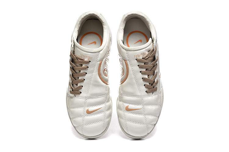 Nike Tiempo 90 Sneakers in White and Pale Yellow - product image from the listing.