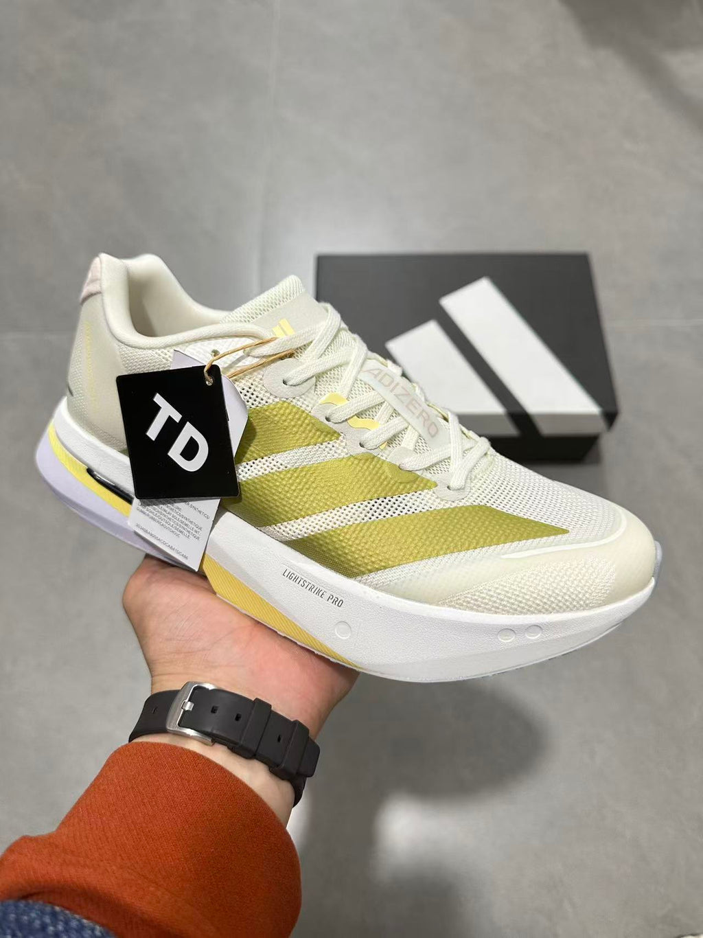 adidas Lightstrike Pro Running Shoes in White Green - product image from the listing.