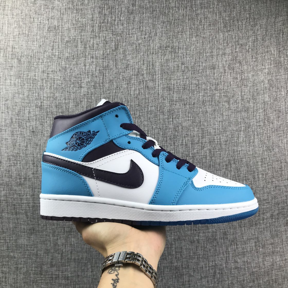 Air Jordan 1 Mid Sneakers in Blue, in White and Black - product image from the listing.