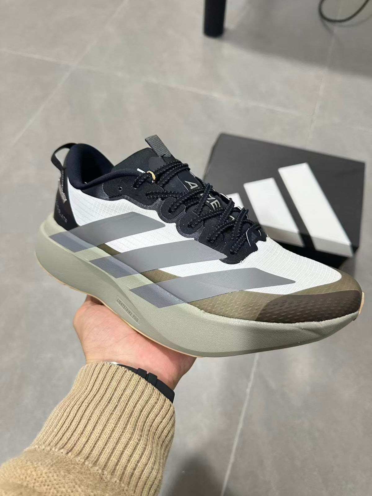 Black and White Adidas Adizero SL Running Shoes - product image from the listing.