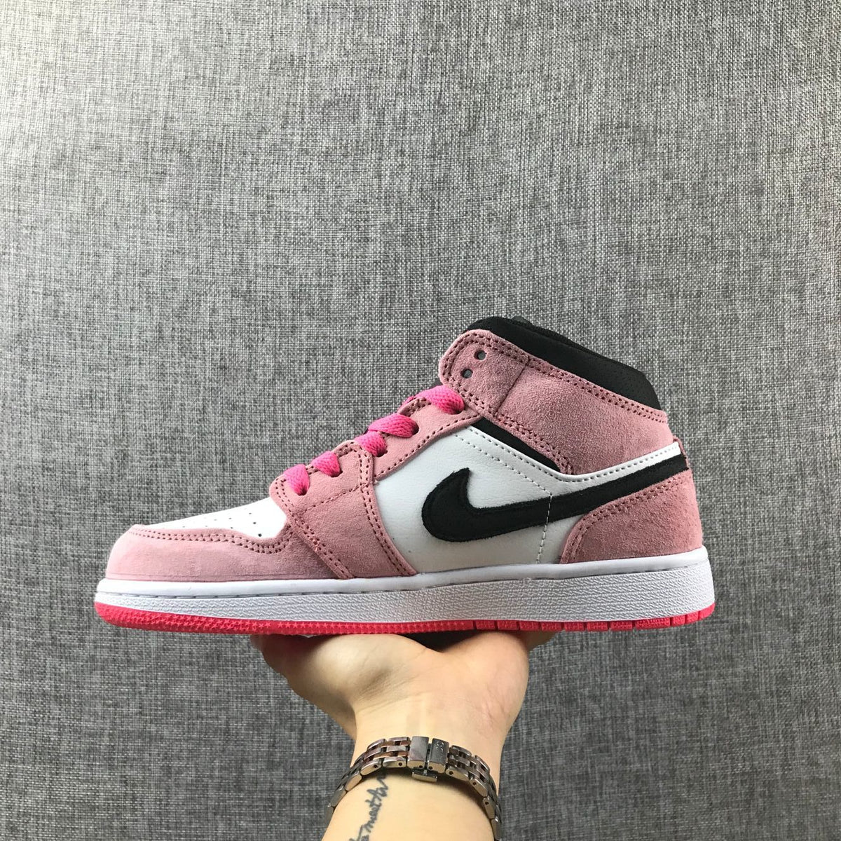 Air Jordan 1 Mid Sneakers in Pink 852542-801 - product image from the listing.
