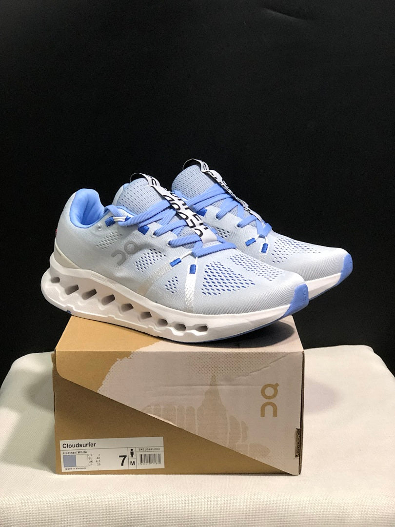 On Cloudsurfer Running Shoes, Heather in White and Blue - product image from the listing.