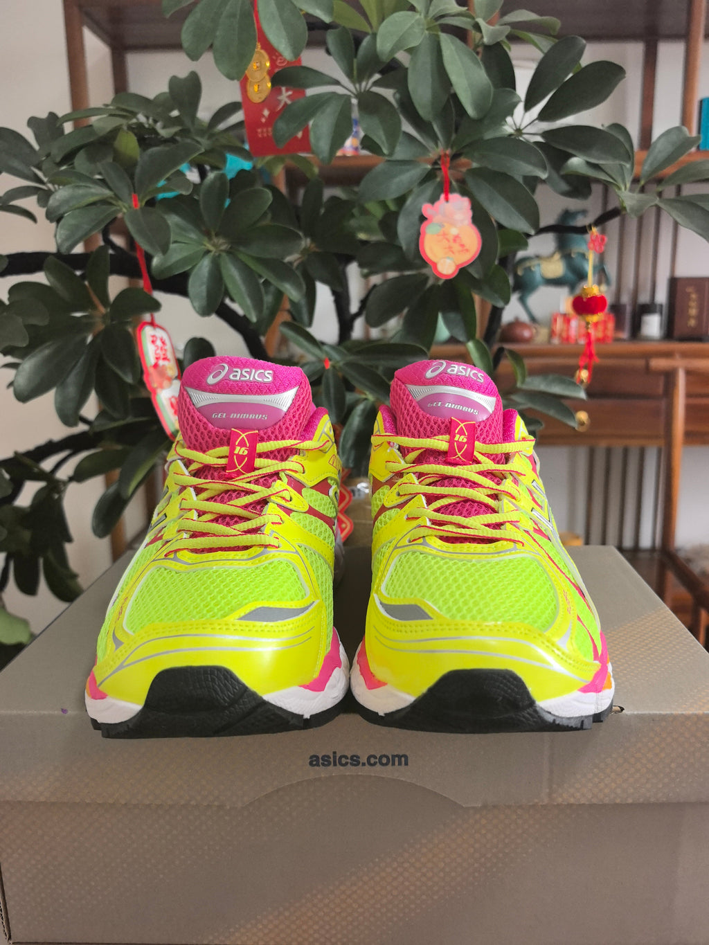 Pink and Lime ASICS GEL-Nimbus 16 Sneakers - product image from the listing.