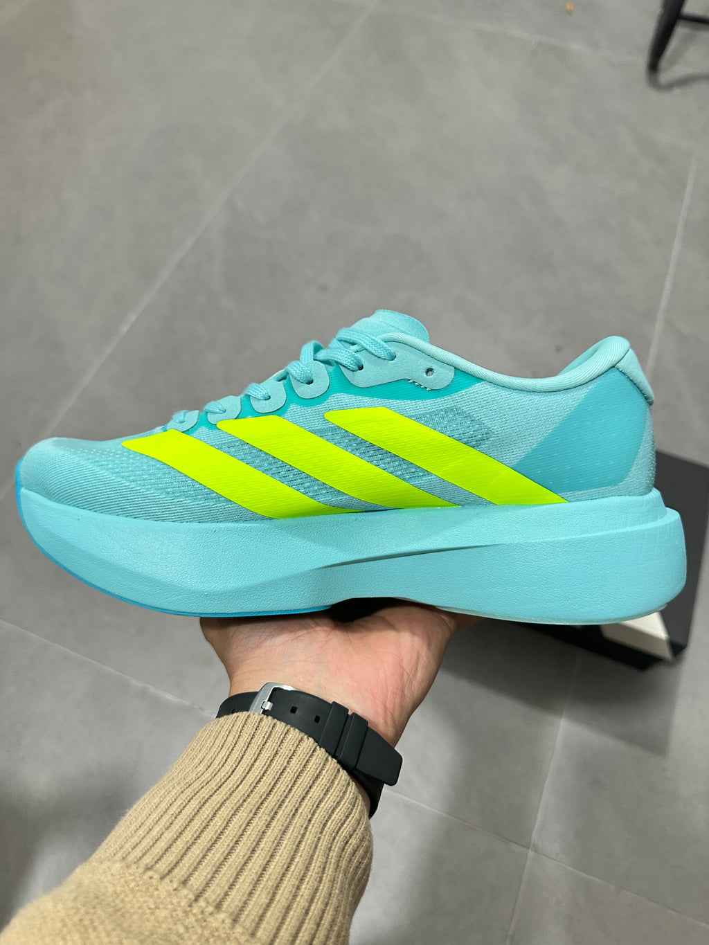 Adidas Lightstrike Pro Running Shoes, in Turquoise and Volt - product image from the listing.