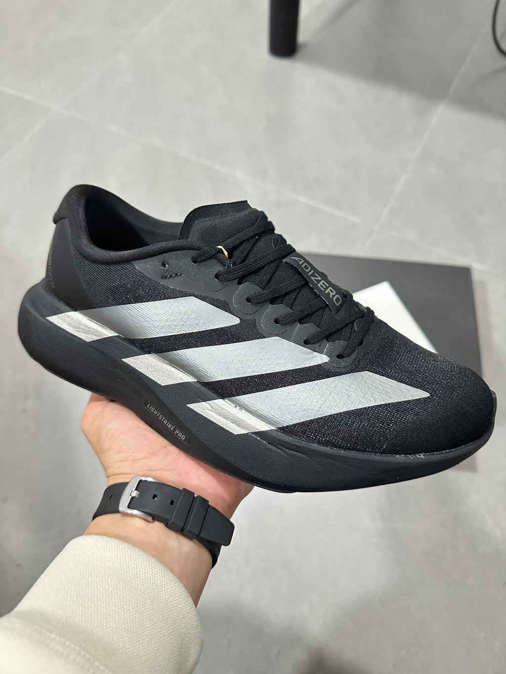 Adidas Lightstrike Pro Running Shoes in Black White JP7147 - product image from the listing.